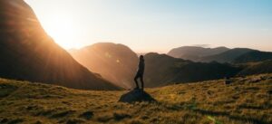 a man standing on a rock in nature